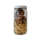 Jar labeled 'Do I Smell Cookies?' with Christmas-themed cookies in the background