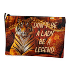 A rectangular zip pouch featuring a printed design of a majestic tiger wearing a pearl necklace, set against a luxurious red and gold patterned background. The text 'DON'T BE A LADY BE A LEGEND' is printed in a bold, light-colored font across the center.