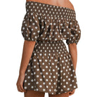 model wearing brown and white polka dot bubble tube top and shorts set