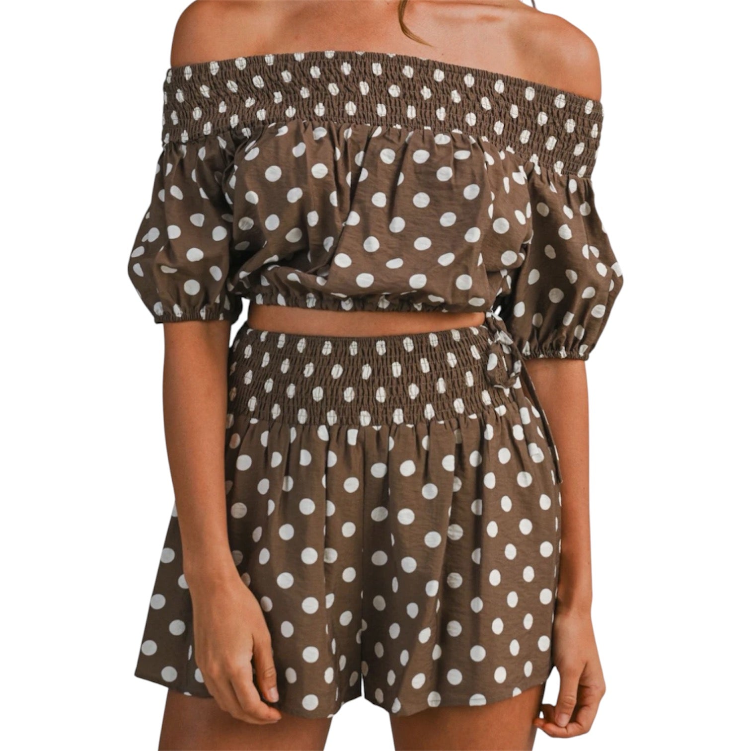 model wearing brown and white polka dot bubble tube top and shorts set