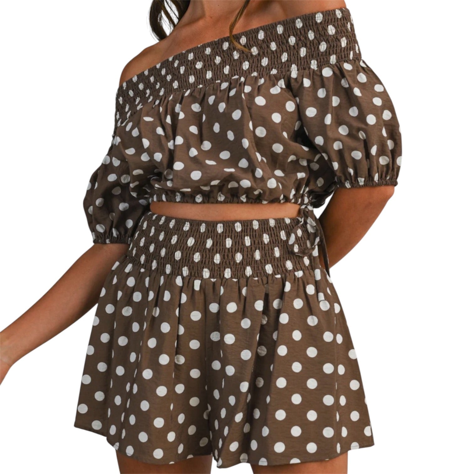 model wearing brown and white polka dot bubble tube top and shorts set