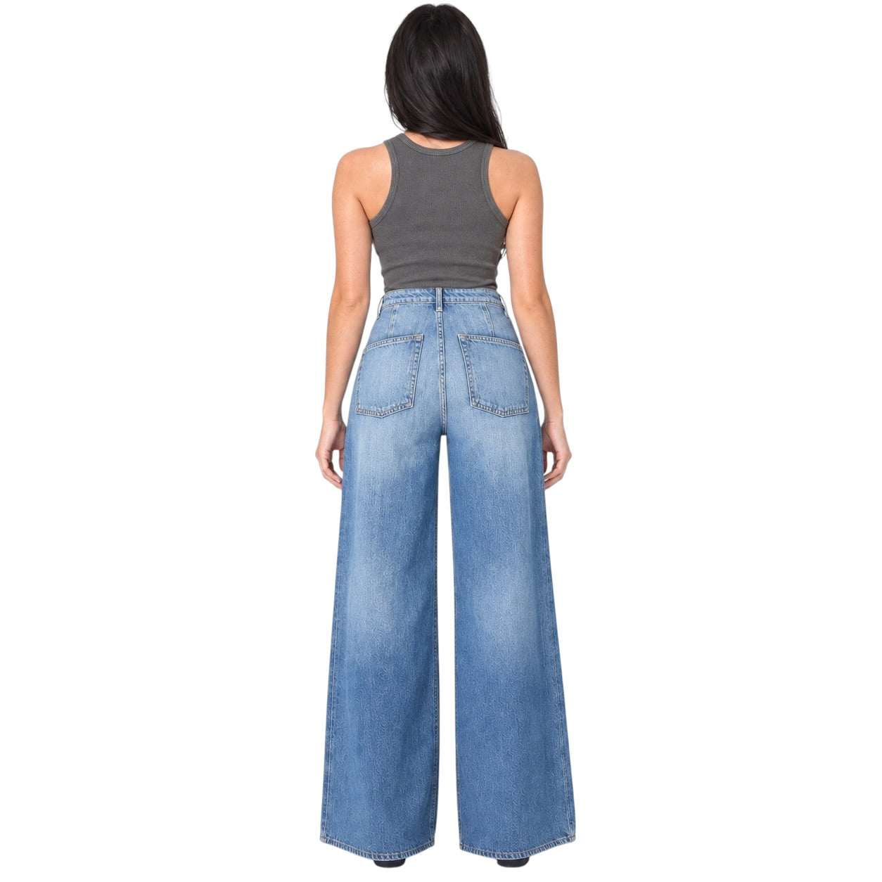 A woman shown from the back wearing a dark gray ribbed tank top and high-waisted, wide-leg blue denim jeans with a faded wash.