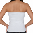 A woman shown from the back wearing a plain white strapless bandeau-style top against a light gray studio background.