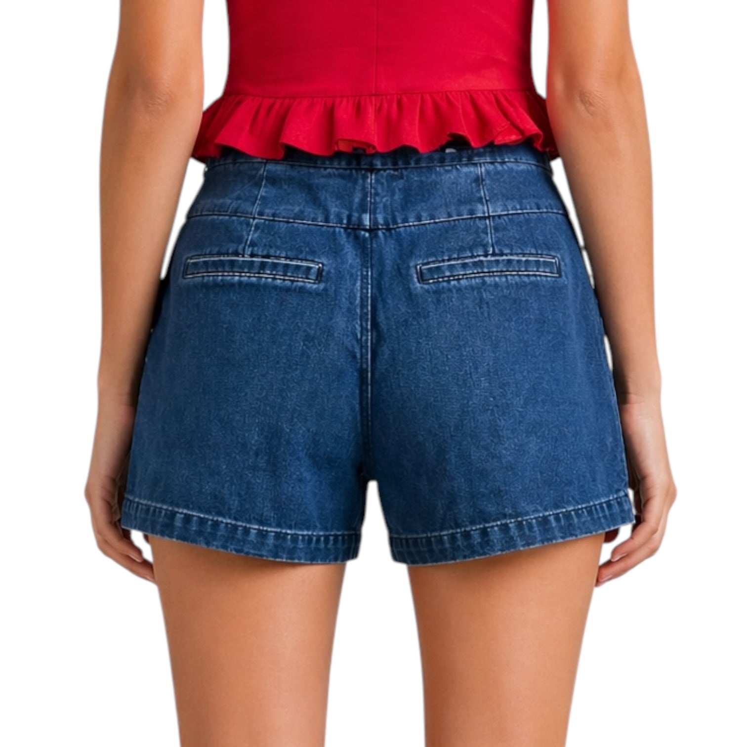 Person wearing a red top with ruffled trim and blue denim shorts on a white background