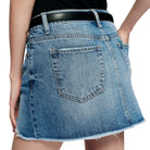 Blue denim skirt with a black belt on a white background