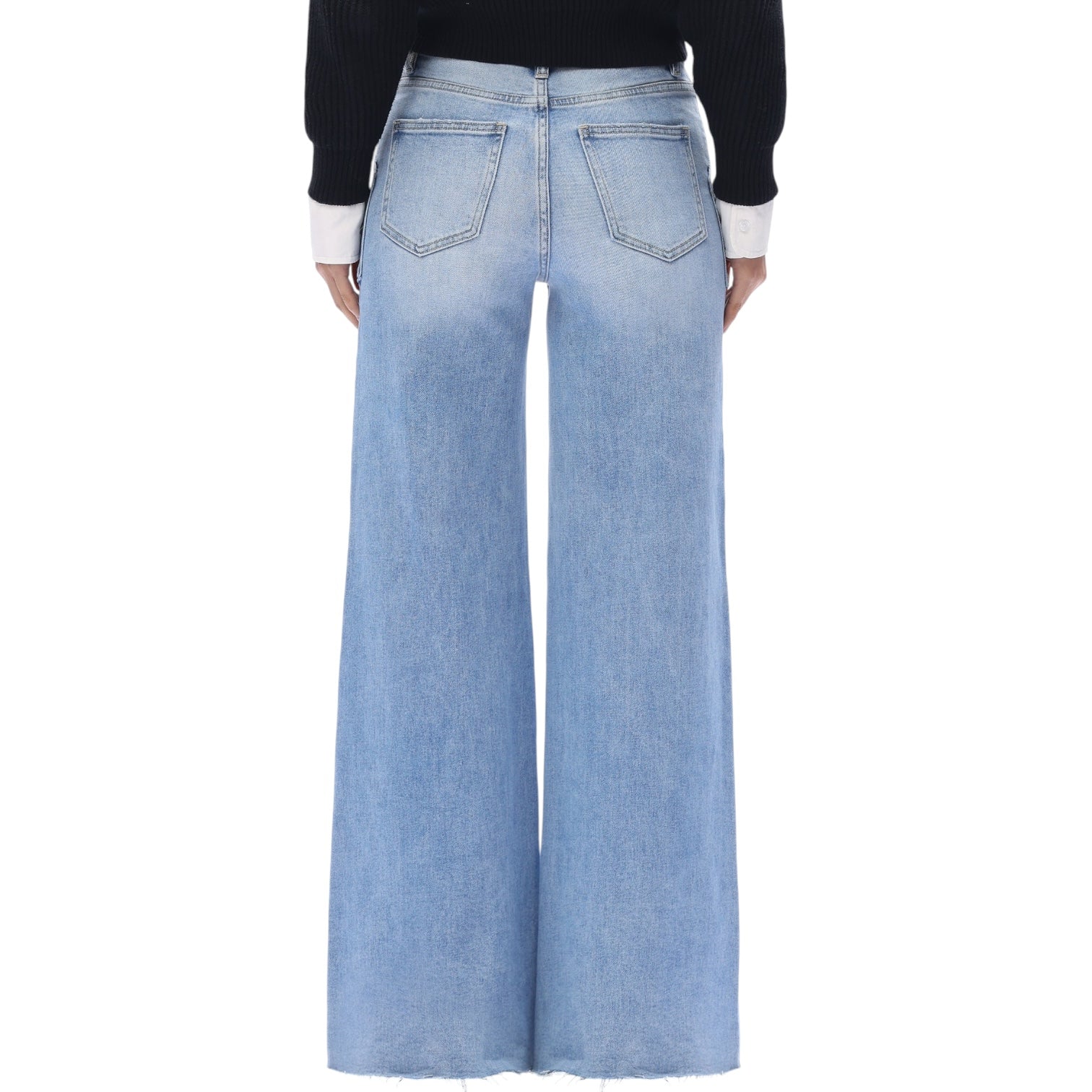 Light blue wide-leg jeans worn by a person on a white background