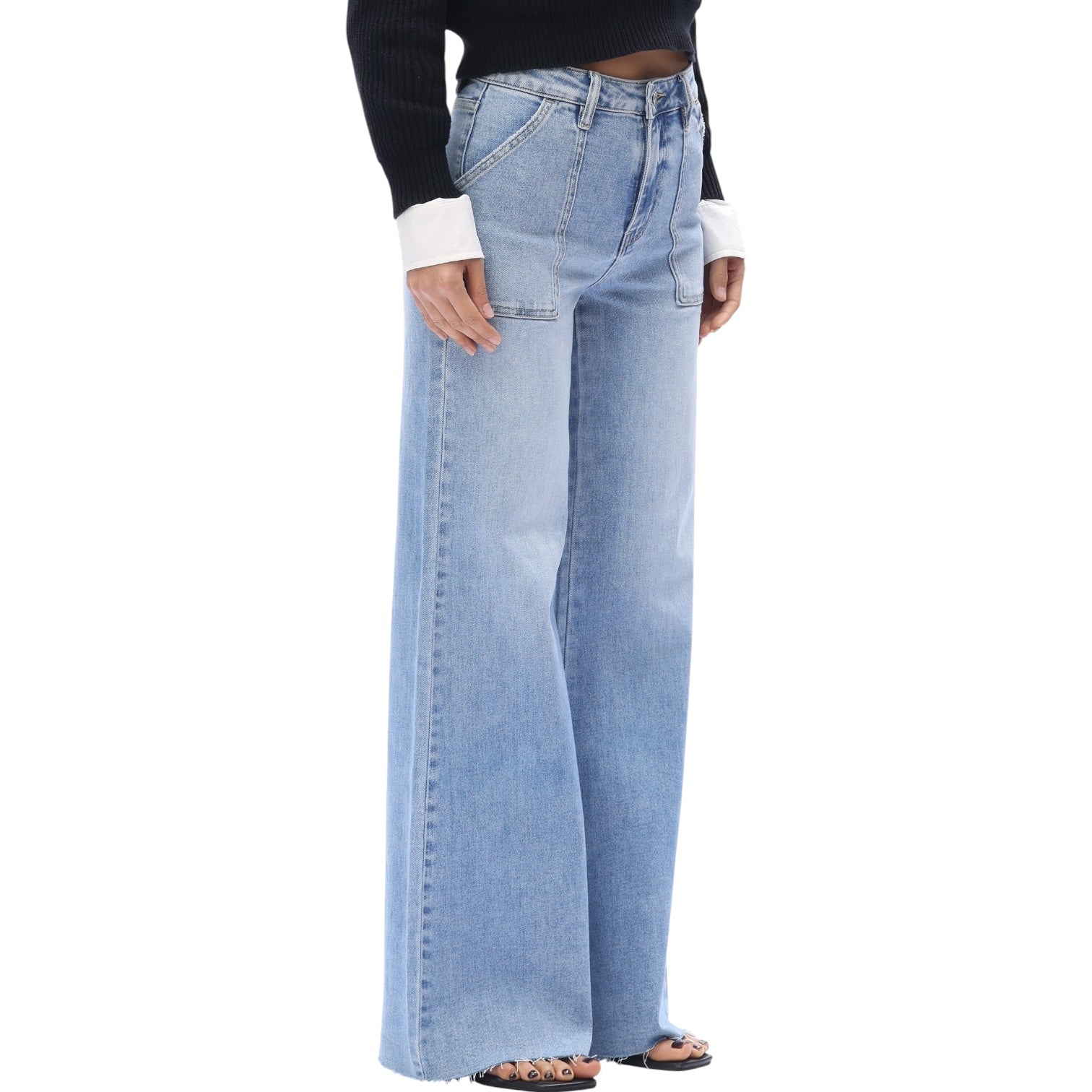 Light blue jeans worn by a person on a white background