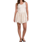 Woman wearing a white dress on a white background