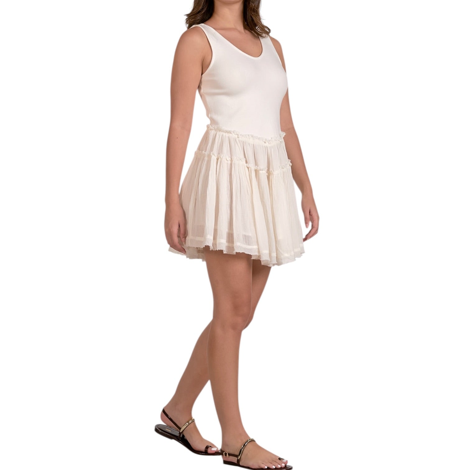 Woman wearing a white dress on a white background
