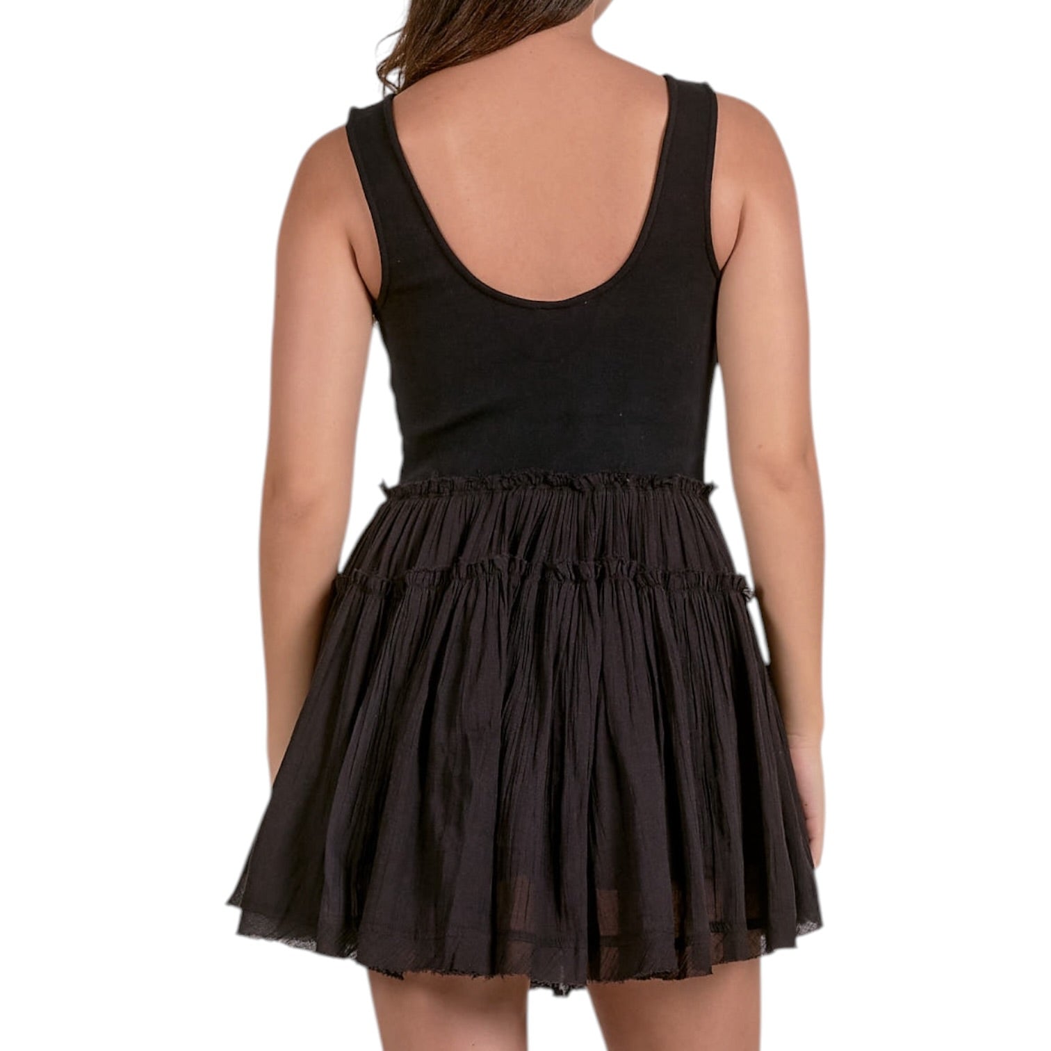 Black dress with layered skirt on a white background