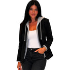 Woman wearing a black jacket with gray accents on a white background