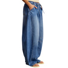 Blue denim wide-leg pants on a white background