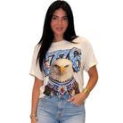Woman wearing a t-shirt with an eagle graphic and '776' design on a white background