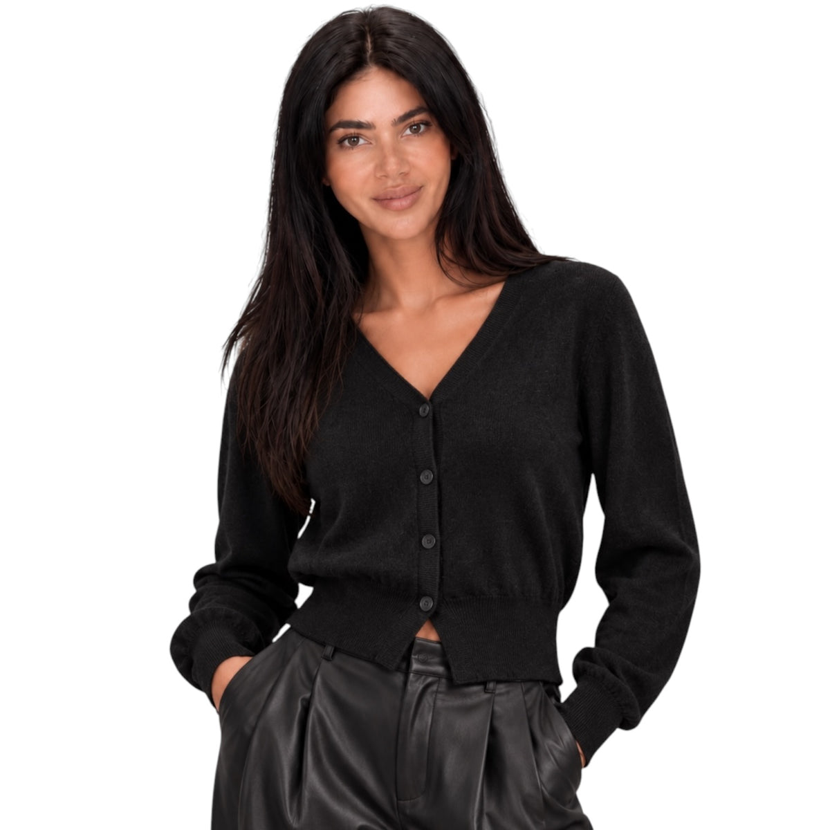 A woman modeling a black long-sleeve V-neck button-up cardigan sweater, paired with black leather-look pants, against a solid white background.