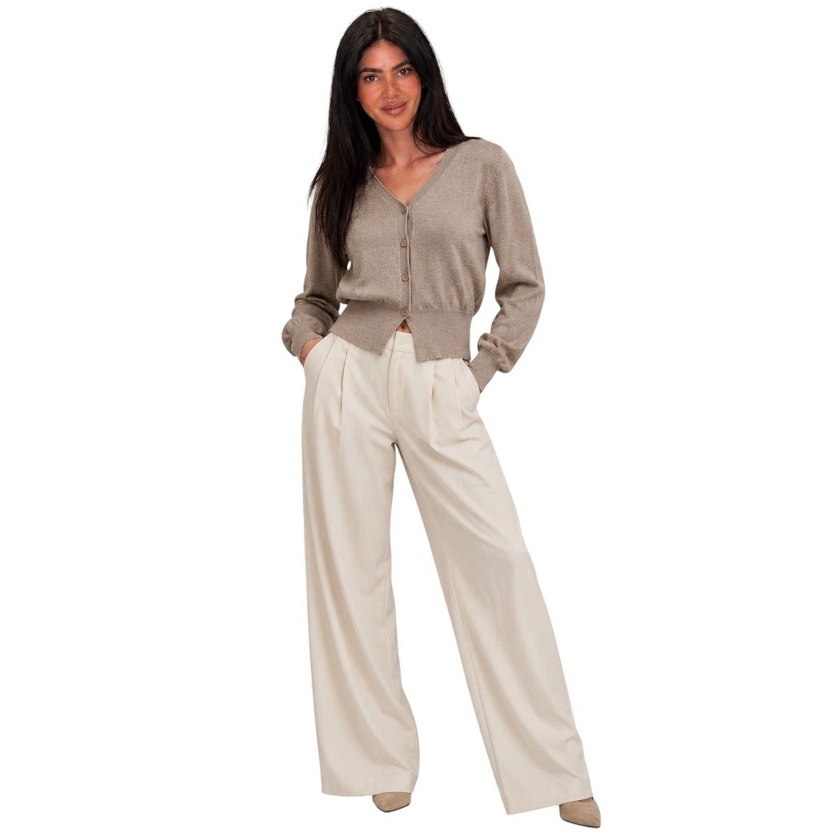 A woman modeling a taupe button-up knit cardigan and cream wide-leg trousers against a plain white background.