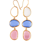 Gold-framed earrings with blue and pink stones on a white background