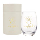 Clear wine glass with 'engaged' design and matching gift box on a white background