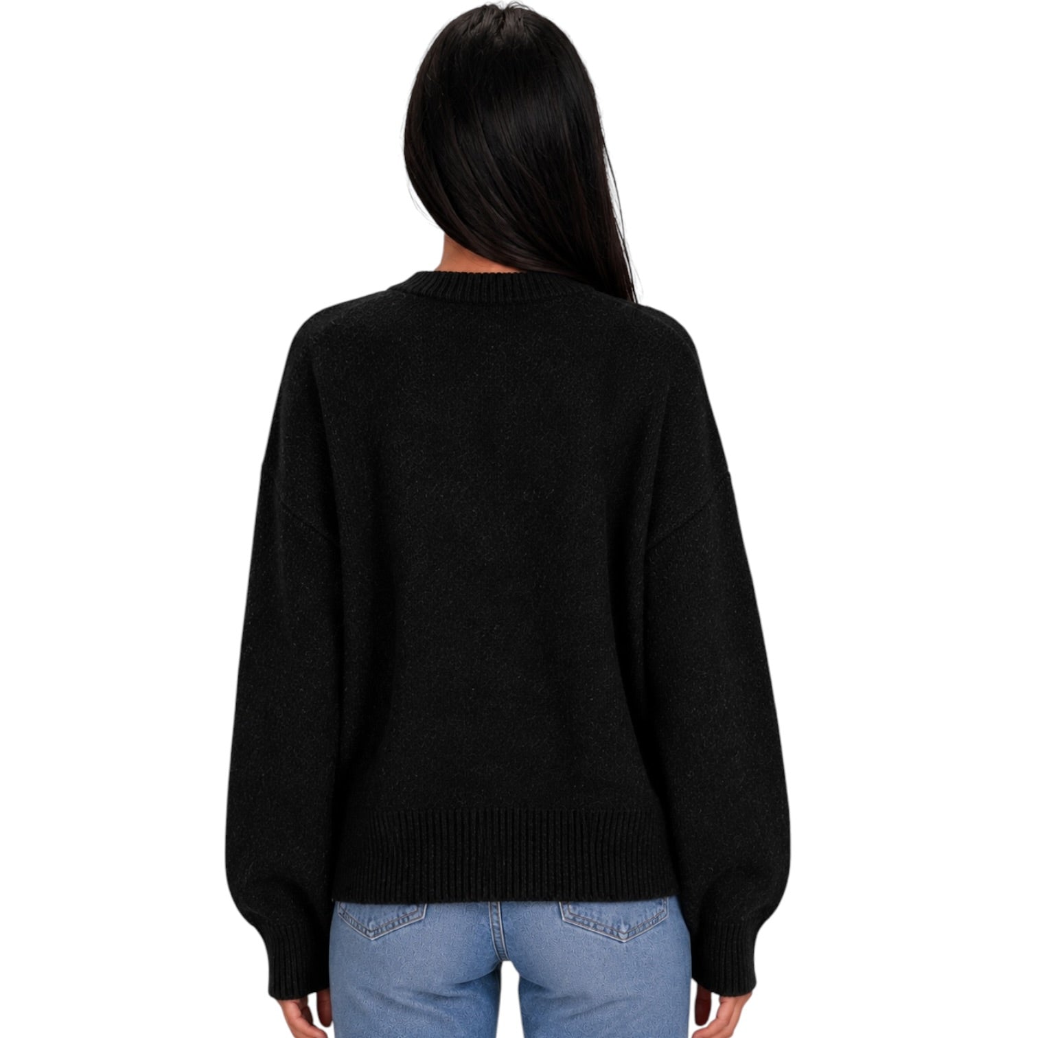 A woman viewed from the back wearing a black knit sweater and light blue jeans against a plain white background.
