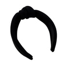 Black headband with a knot on a white background