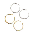 Set of gold and silver hoop earrings on a white background