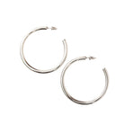 Pair of silver hoop earrings on a white background