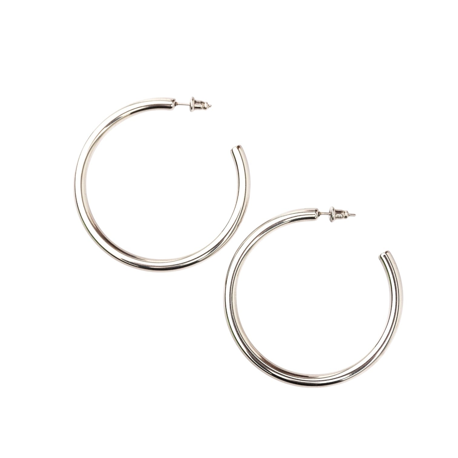 Pair of silver hoop earrings on a white background