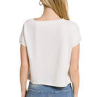 White blouse worn by a person on a white background