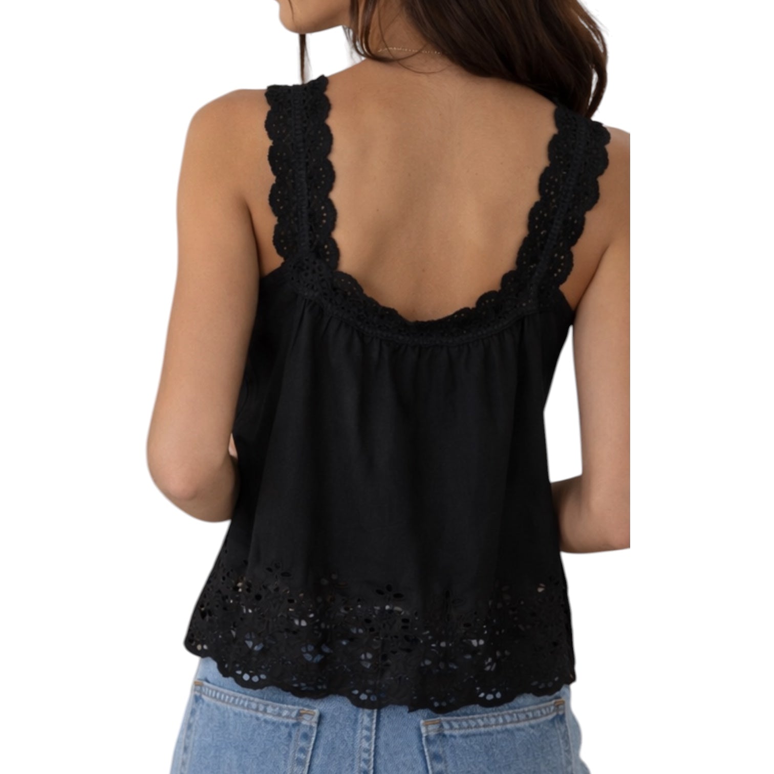 Black lace-trimmed tank top worn by a person on a white background