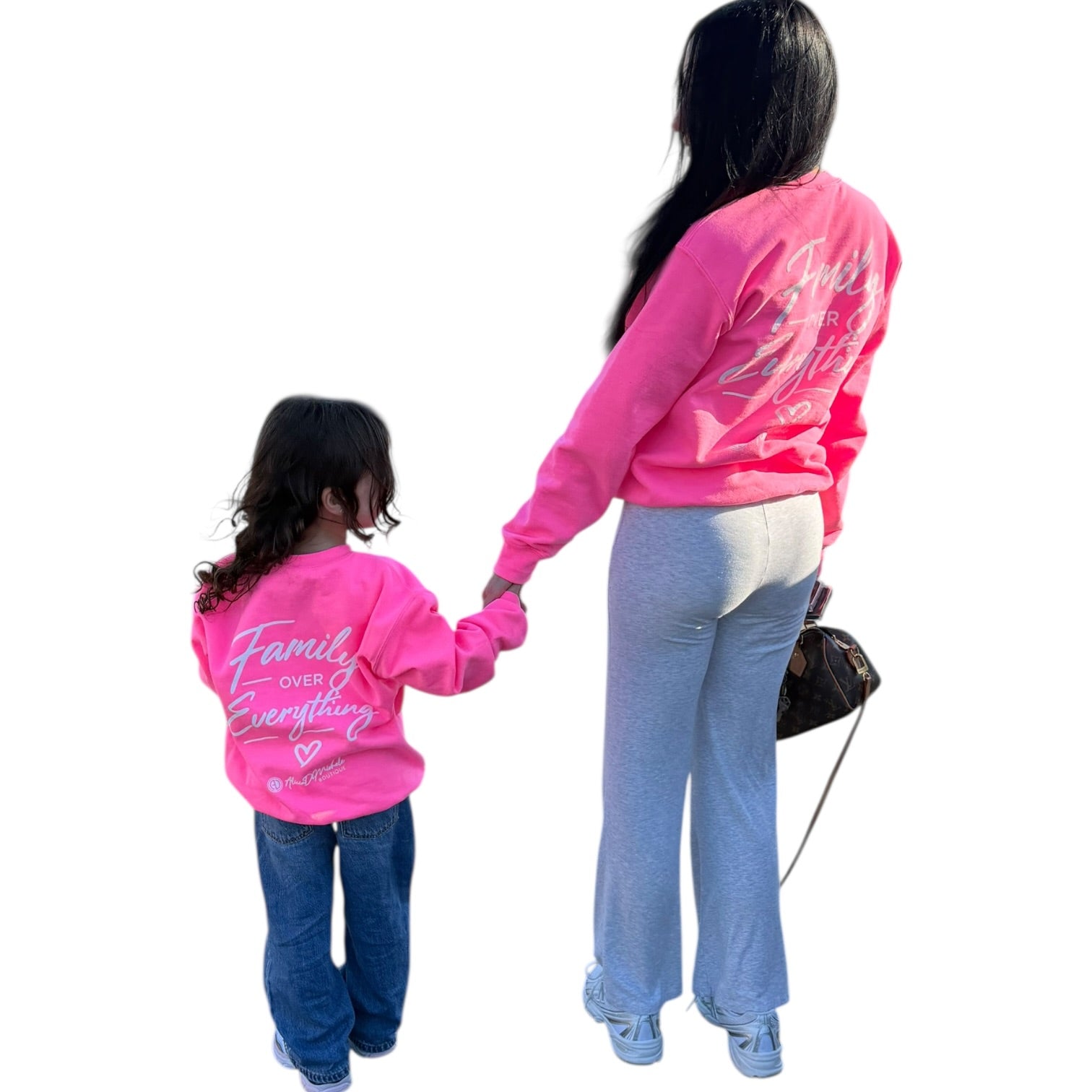 Two people wearing pink sweatshirts with text, standing back-to-back on a white background.