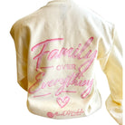 pale yellow sweatshirt with pink 'Family Over Everything' text and heart design on a white background