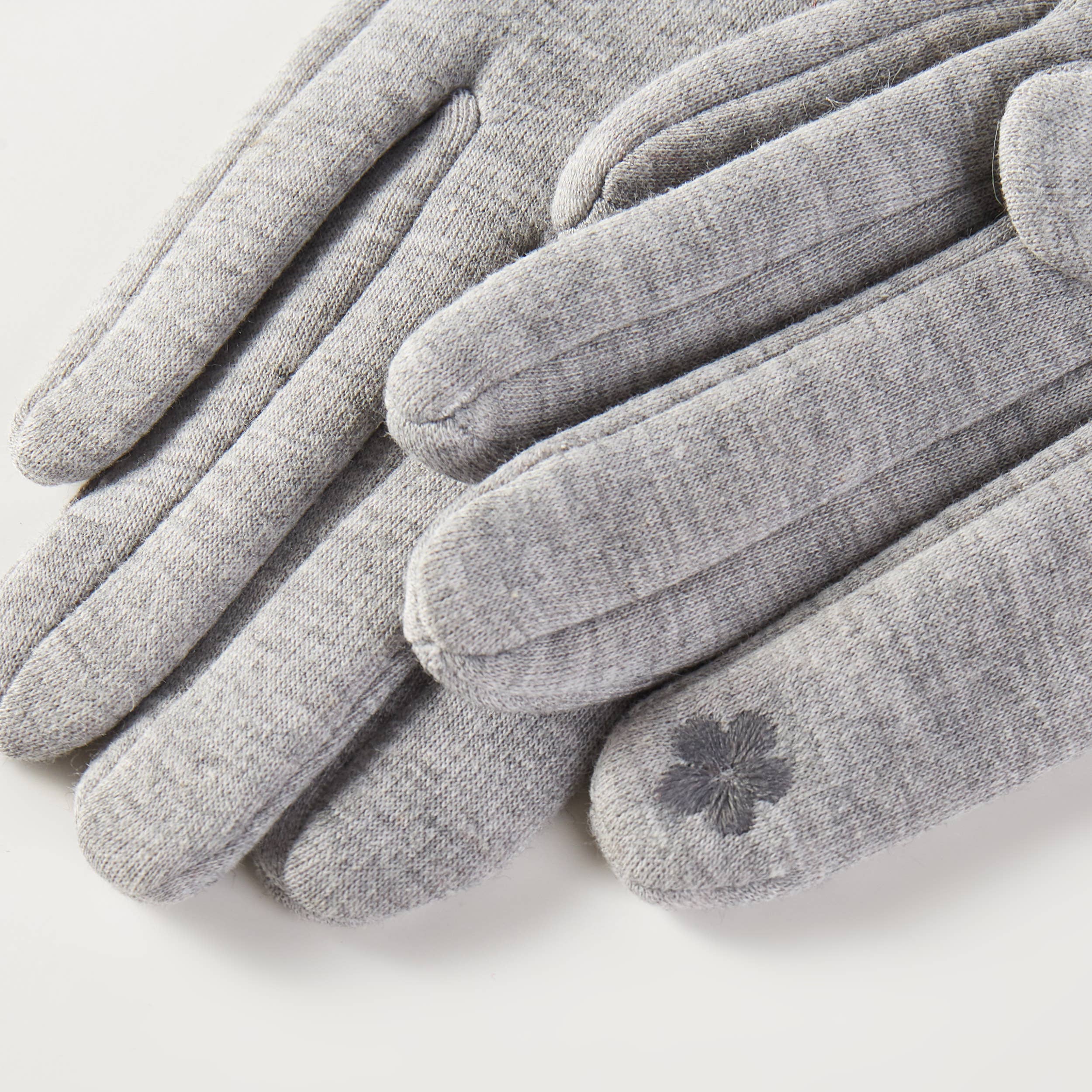 Winter gloves with faux fur trim, soft and cozy cold-weather accessory.