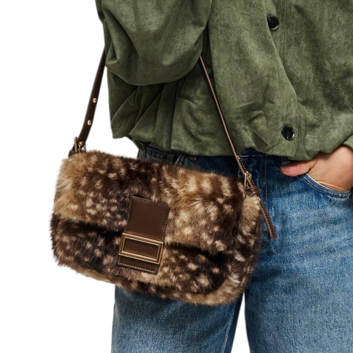 A person wearing an olive green shirt and blue jeans carries a brown and black spotted faux fur shoulder bag with a brown leather strap and front clasp.