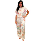 Woman wearing a floral outfit on a white background