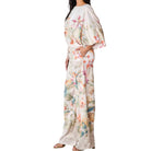 Woman wearing a floral set on a white background