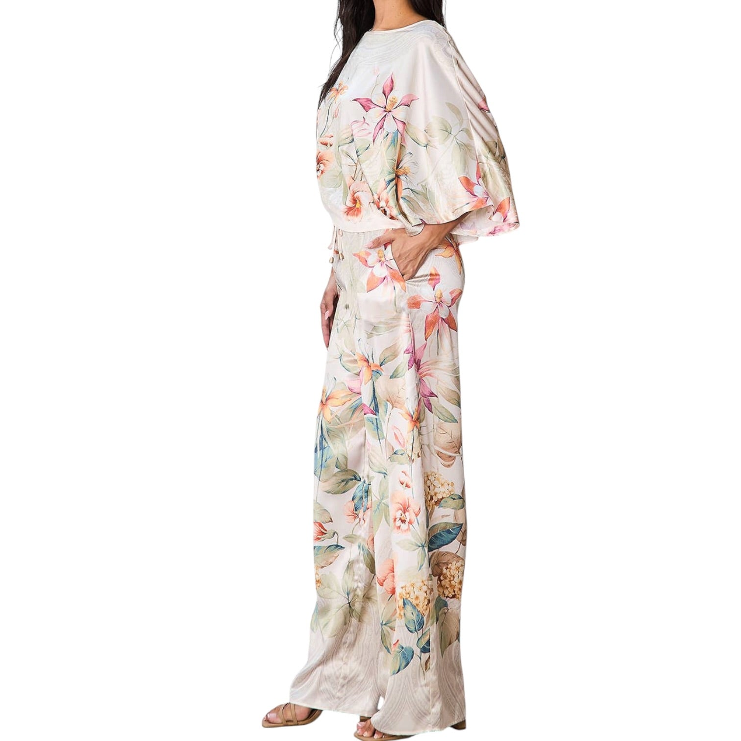 Woman wearing a floral set on a white background