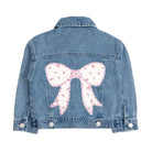Denim jacket with a floral bow design on a white background