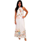 Woman wearing a white floral dress on a white background