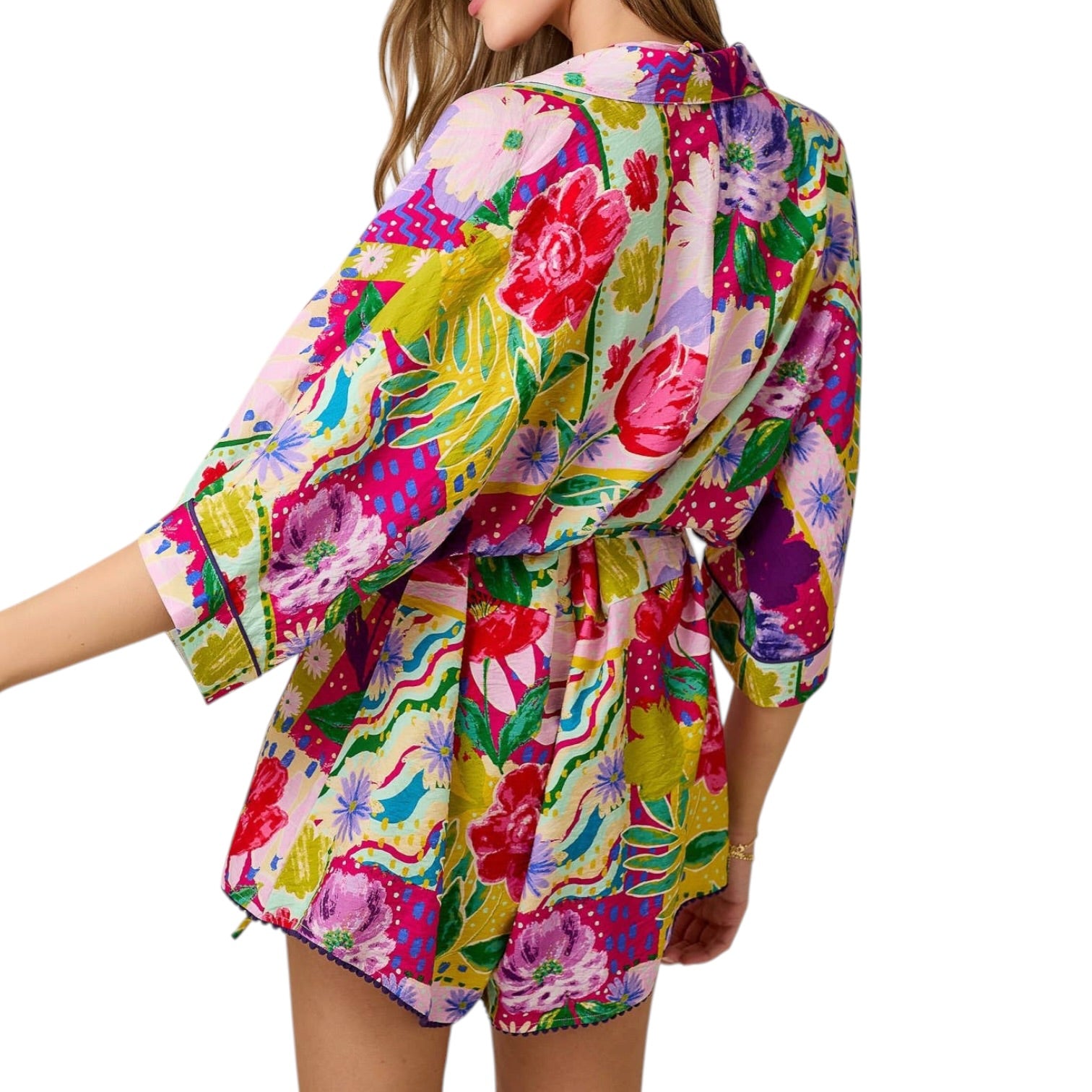 Colorful floral romper on a white background
