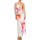 Woman wearing a strapless floral set on a white background