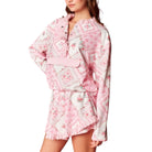 Pink floral lounge set on a white background