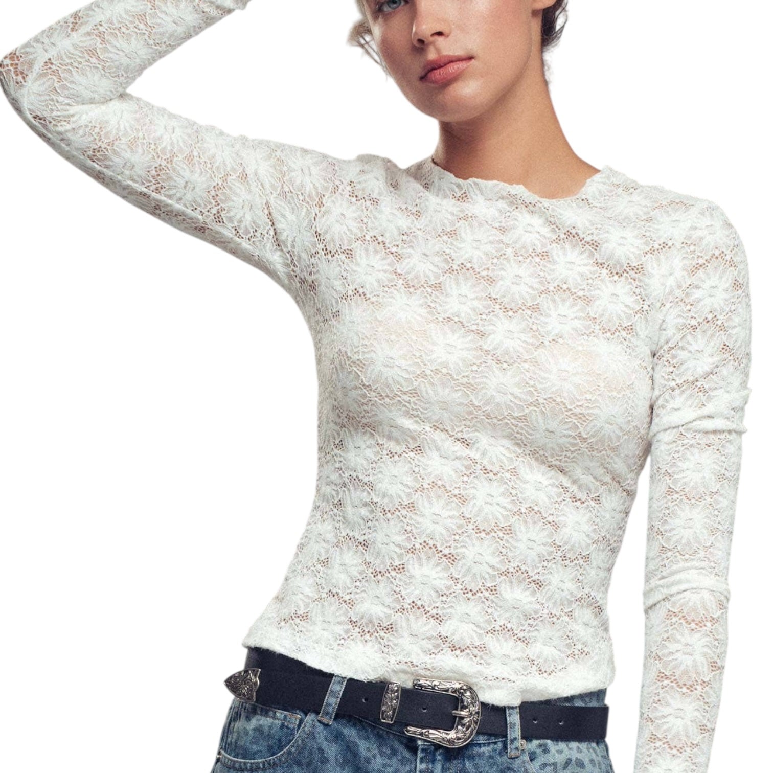 White lace long-sleeve top worn by a person on a white background