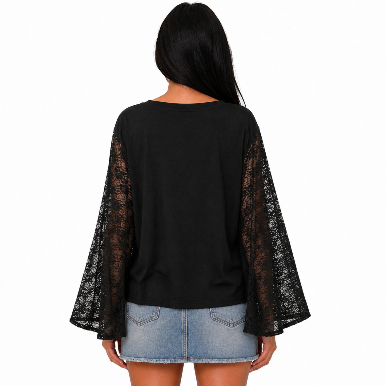 A woman viewed from the back wearing a black top with sheer black lace bell sleeves and a light blue denim mini skirt, against a plain white background.
