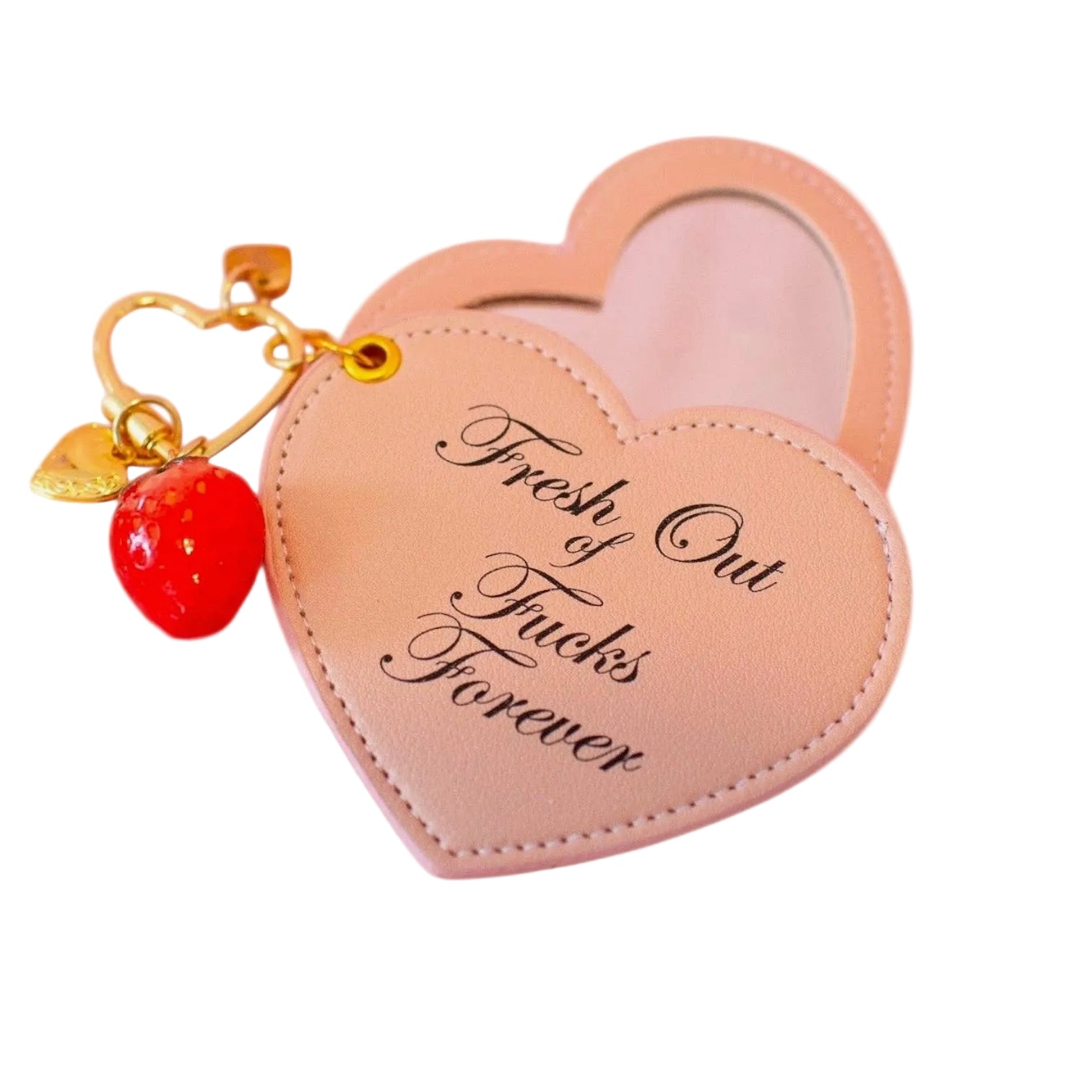 Heart-shaped pink case with 'Fresh Out of Trunks Forever' text and cherry charm on a white background