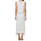 White lace set with fringe details on a white background