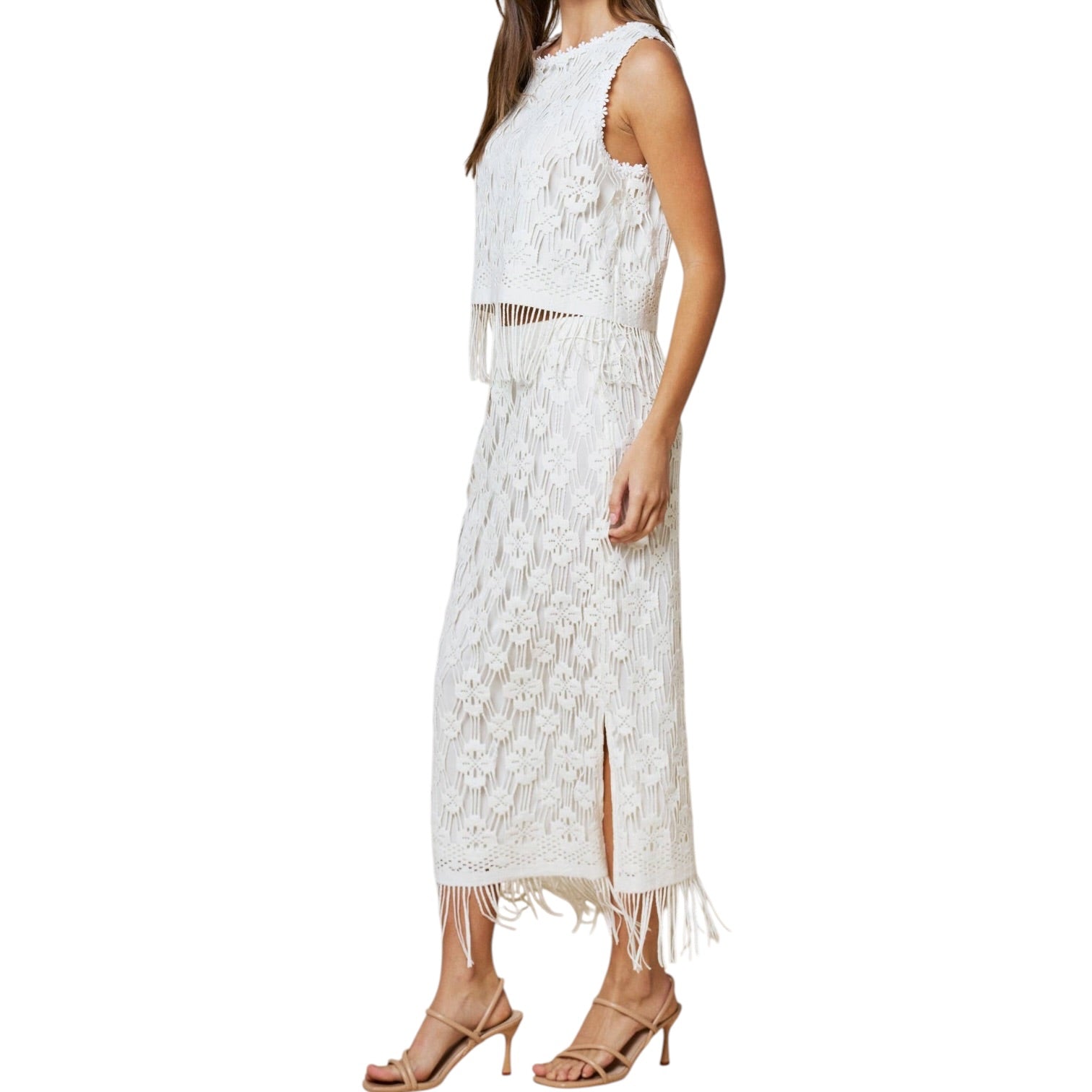 White lace set with fringe details on a white background