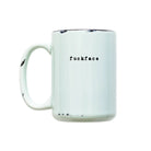 Mint green mug with 'fuckface' text on a white background