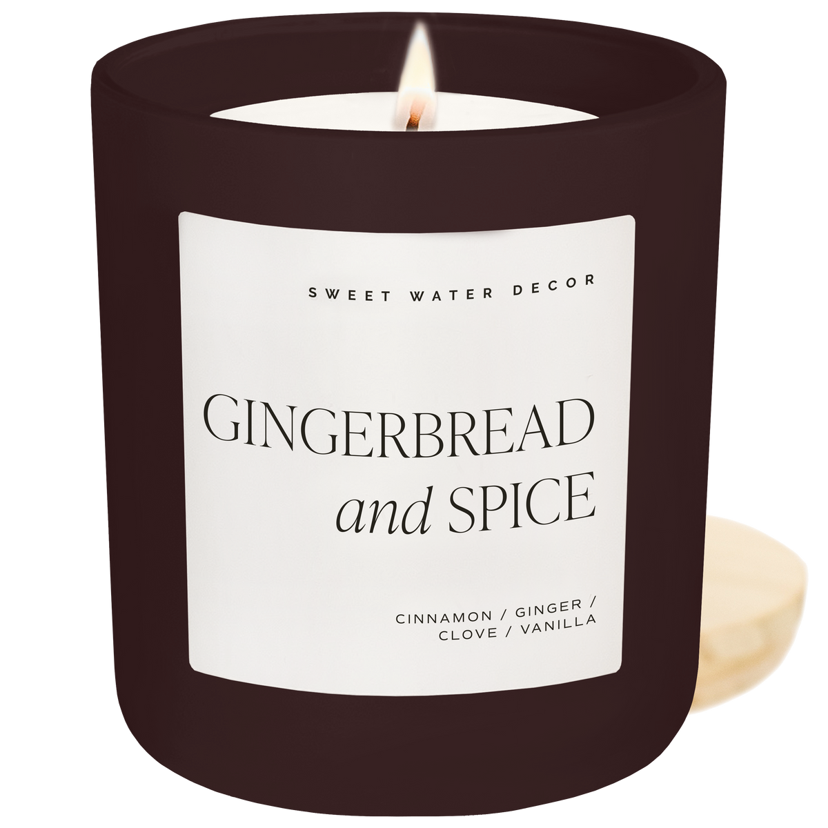 Candle with 'Gingerbread and Spice' label on a white background