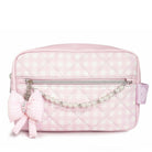 Pink quilted cosmetic bag with a bow and pearl details on a white background