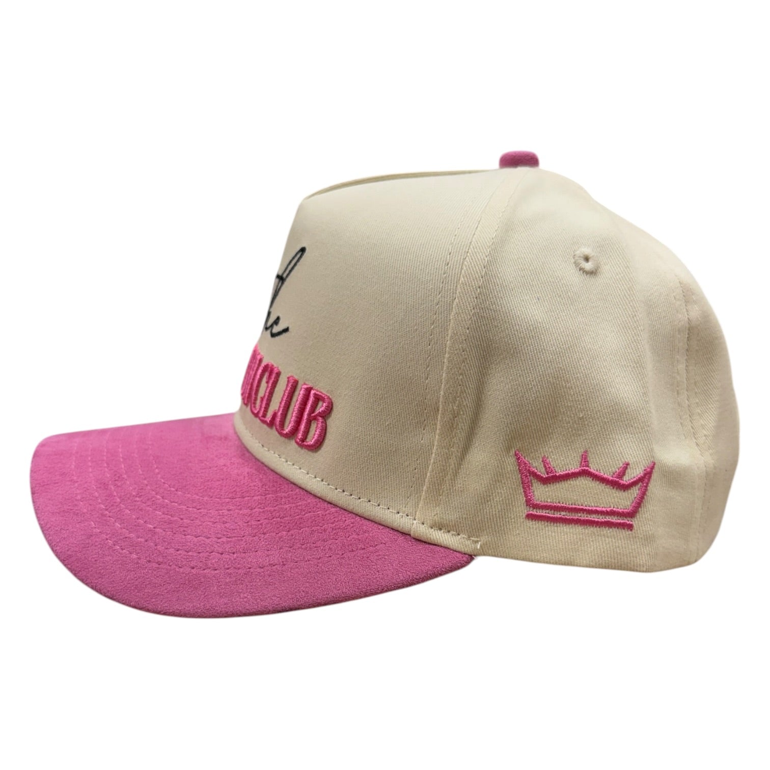 Two-tone beige and pink cap with embroidered designs on a white background