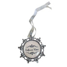 A gothic-style hanging ornament with a round white center featuring the text 'Girlfriends Matter' in black script, surrounded by an ornate silver filigree frame and a white ribbon loop at the top.